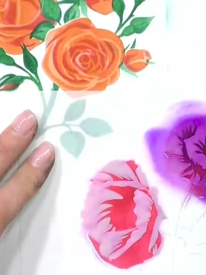 Step 5: Position stencil number three over the flower and apply a purple ink colour using a blending tool. This darker
