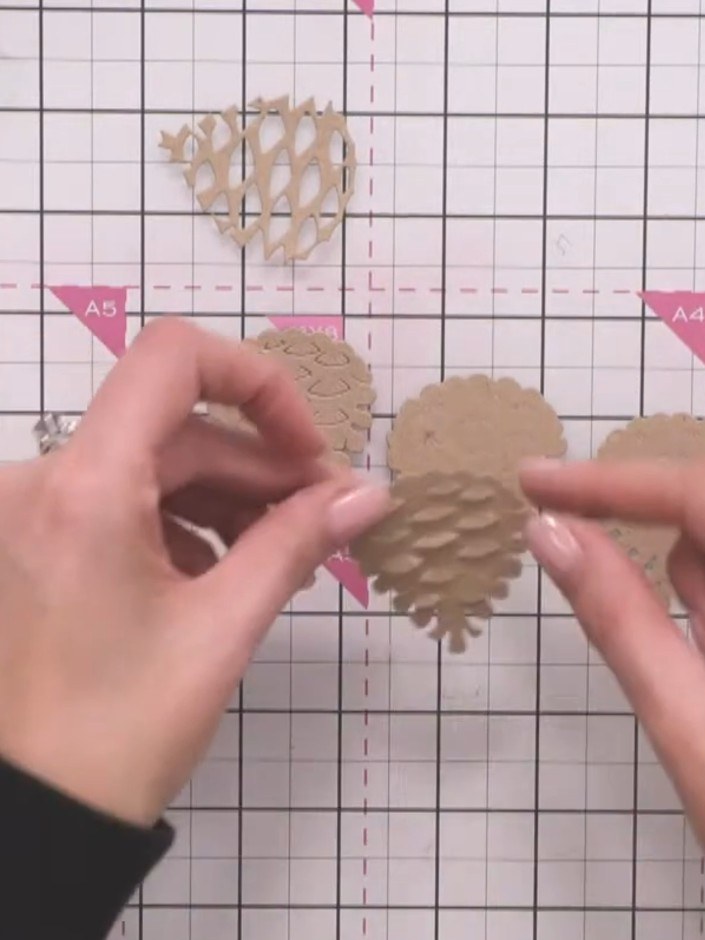 Step 7: Gently pinch the sides of each pine cone piece to create a subtle curve, giving them dimension.
