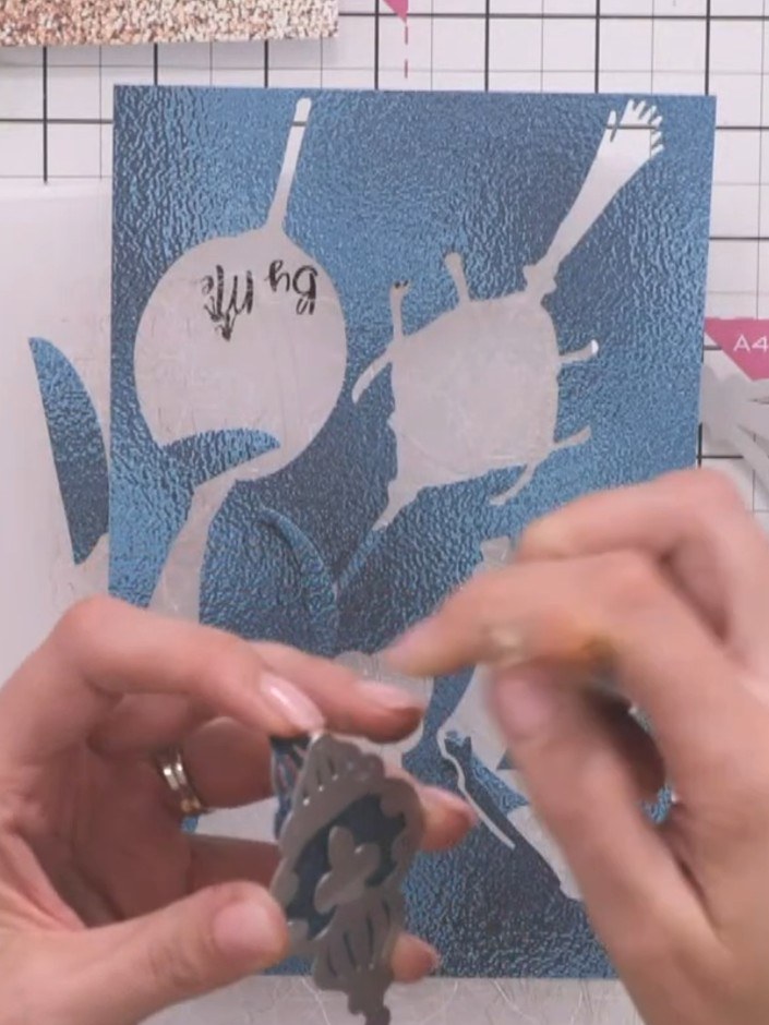 Step 4: Blend white ink onto one side of the blue bauble base using a blending tool. Create a soft halo effect by work