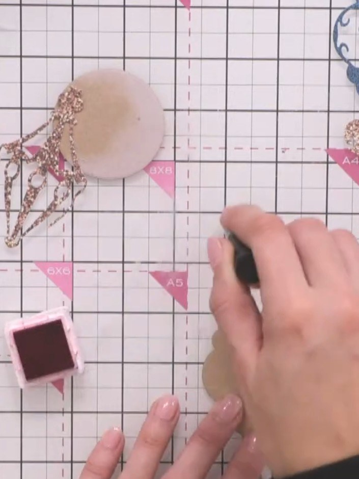 Step 9: Adhere the completed bauble design to your card base, positioning it centrally to create your dimensional Chri