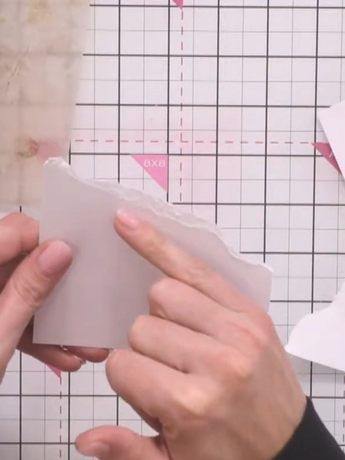 Step 1: Tear pieces of white card randomly to create jagged snow drift shapes. Use both the torn edges for different e