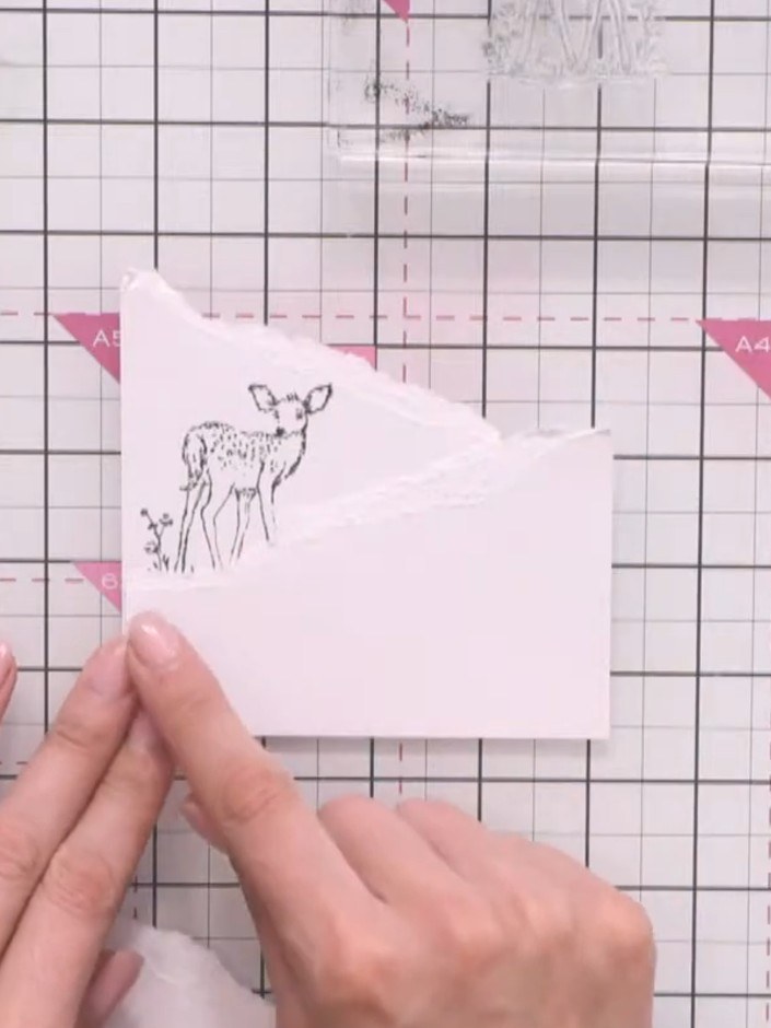 Step 2: Stamp the deer image from the Secret Forest collection in black ink onto white card, positioning it as if stan