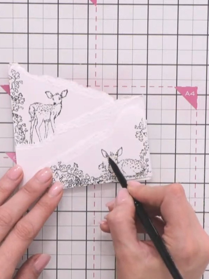 Step 5: Colour the stamped stags with brown watercolour. Add shadow to the eyes, ears, and around the base of each dee