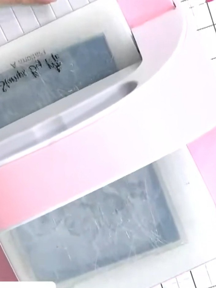 Step 5: Remove the cardstock from the embossing folder and inspect the embossed result. Check both the raised side and