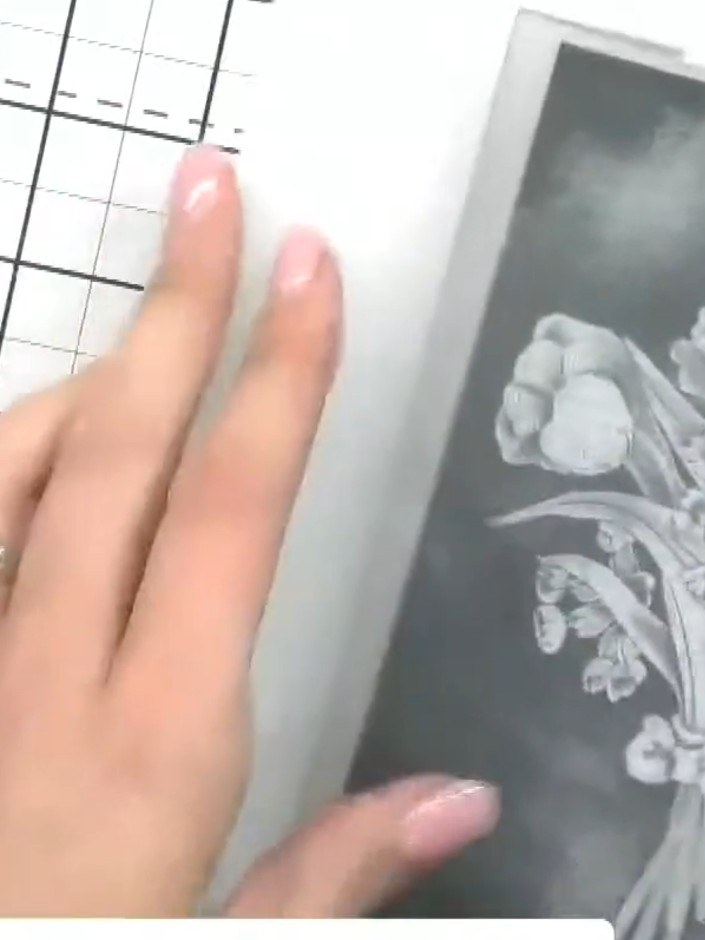 Step 2: Apply black ink to both sides of the embossing folder using a black ink pad. Ensure the raised design areas ar