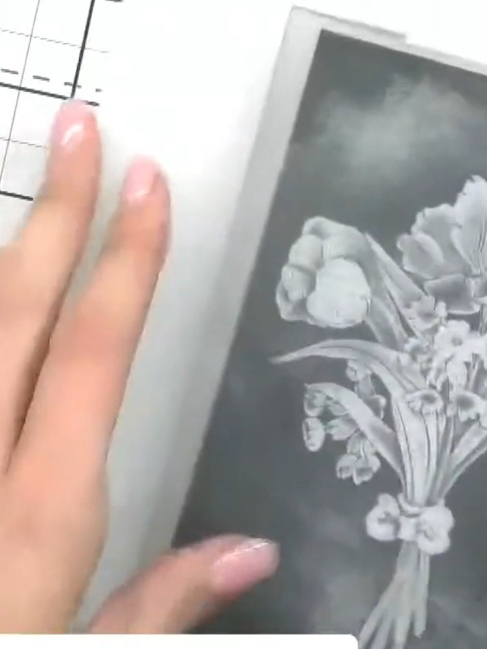 Step 4: Run your prepared cardstock and embossing folder through your embossing machine to create the raised floral de