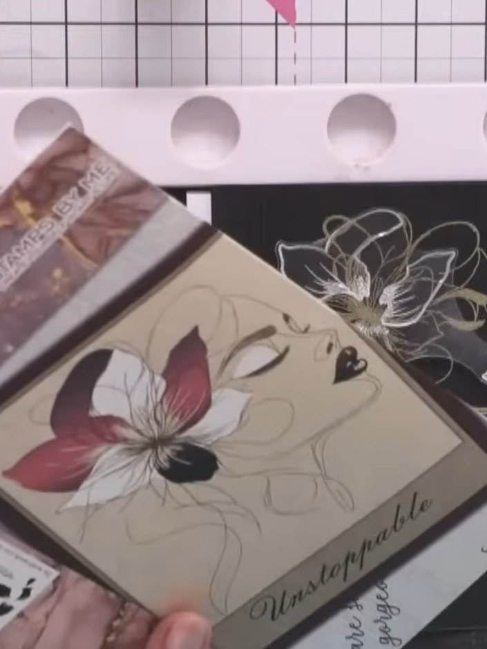 Step 7: Once the embossing powder has cooled completely, gently brush away any remaining anti-static powder from the b