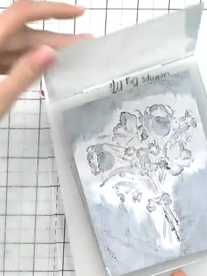 Step 6: For deeper detail, flip the card over and run it through the embossing folder again with black ink on the fold