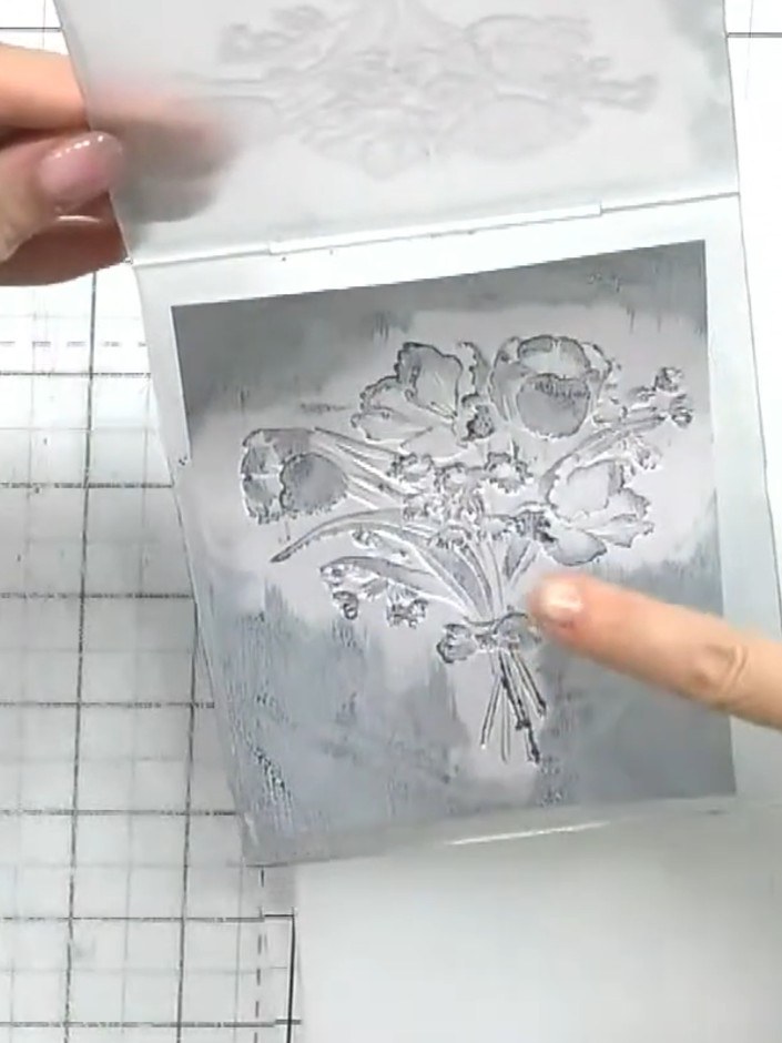 Step 7: Use a white ink pad to gently dab and highlight the raised areas of the embossed image. This will restore fine