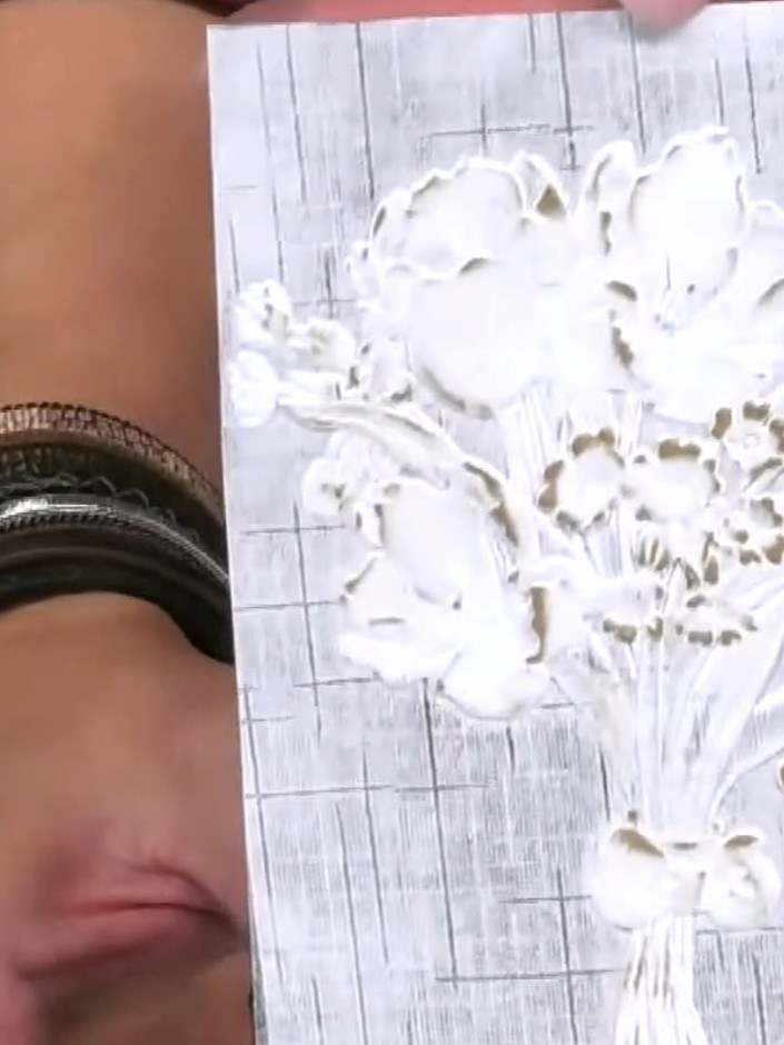 Step 4: Step back and admire your finished embossed design with its subtle gold metallic shimmer highlighting the rais