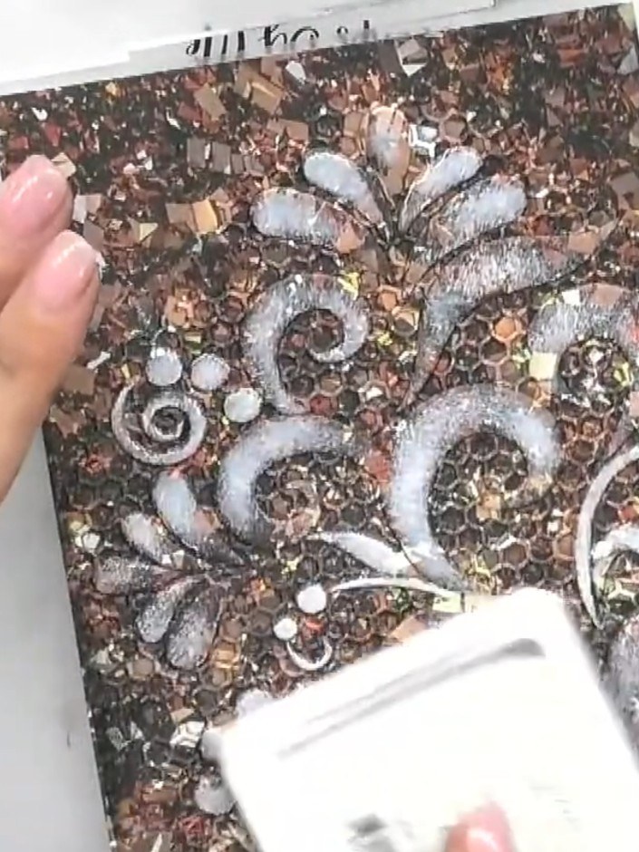 Step 1: Start with embossed cardstock that has already been coloured with brown and copper tones and textured with hon