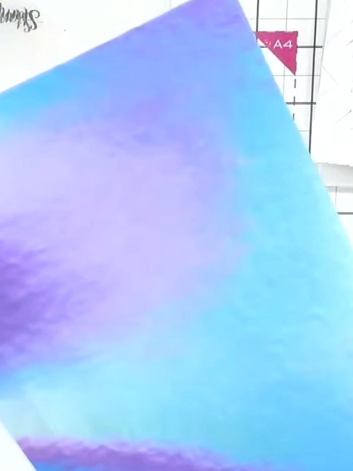 Step 1: Select a sheet of holographic-effect uncoated paper from your pad. This paper has a beautiful iridescent finis