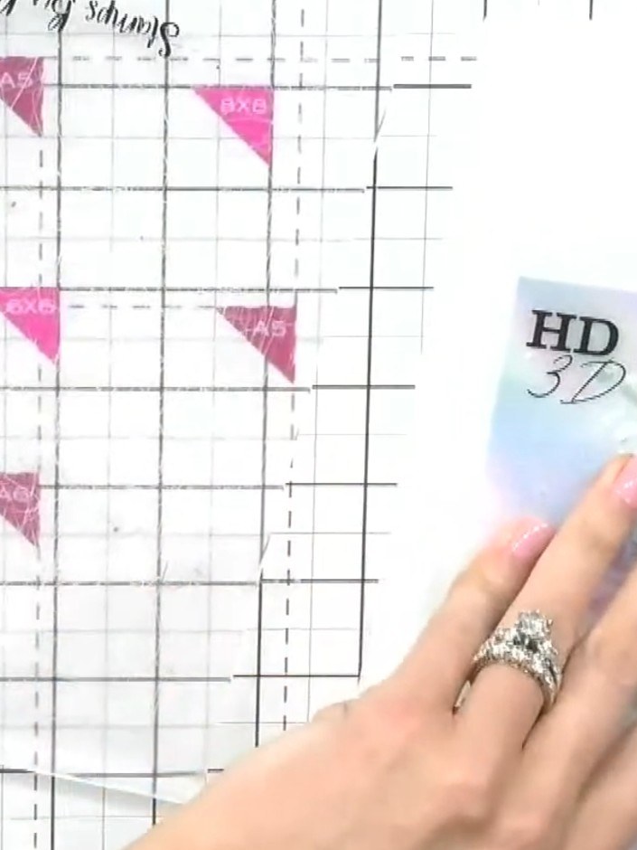 Step 7: Mount your finished embossed holographic piece onto a card base. Add any additional embellishments as desired 