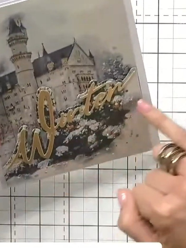 Step 4: Adhere the layered topper to the card front, positioning it to complement the corner-to-corner 'Winter' word p