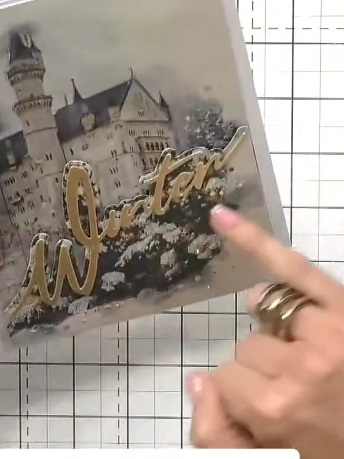 Step 2: Cut out the 'Winter' word die from gold card. Position it so it extends beyond the top edge of the card to cre