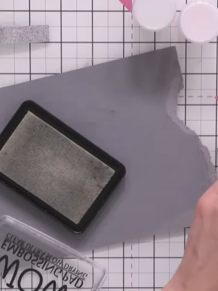 Step 4: Repeat the process with the second strip, covering it with sticky embossing ink and applying a different colou