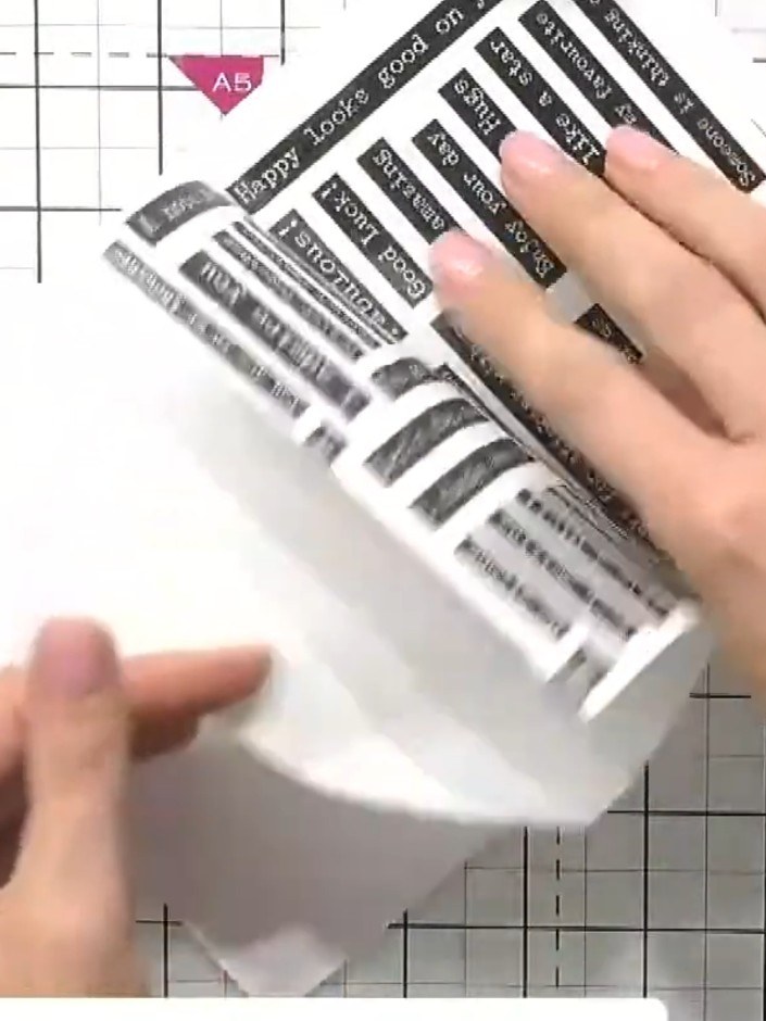 Step 4: Peel away the backing from the sticky-back washi tape sentiment sheet. Position the acetate sheet you want to 