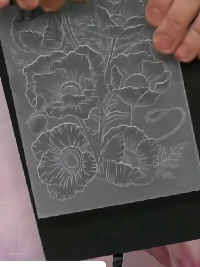 Step 2: Ink both sides of the HD 3D embossing folder lightly with black ink using a brush, ensuring the raised floral 