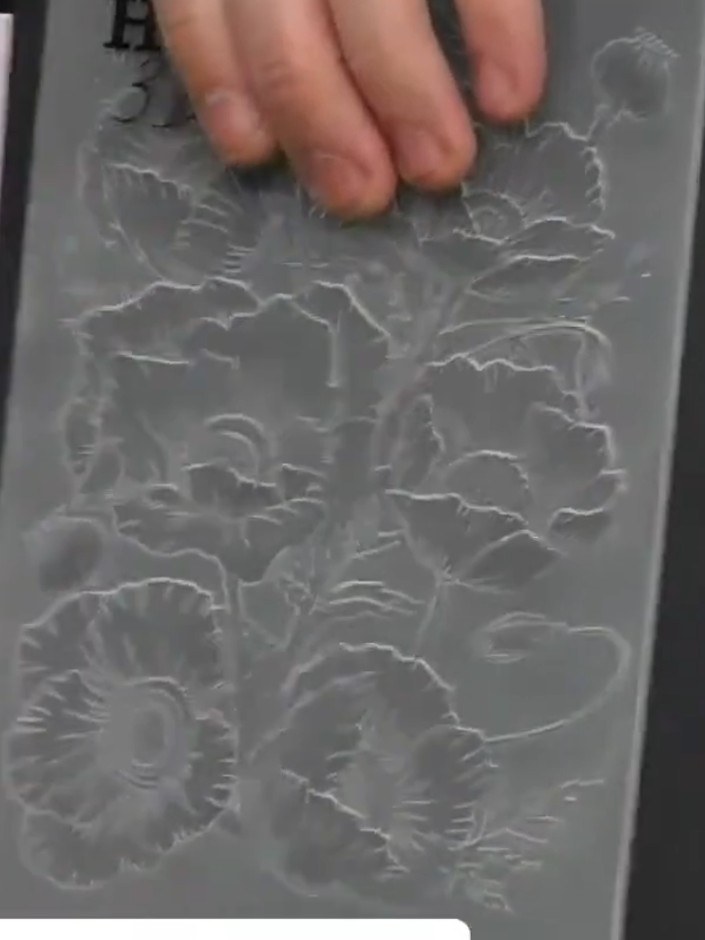 Step 4: Inspect both the front and back of the embossed card to see the raised and recessed patterns. Choose which sid