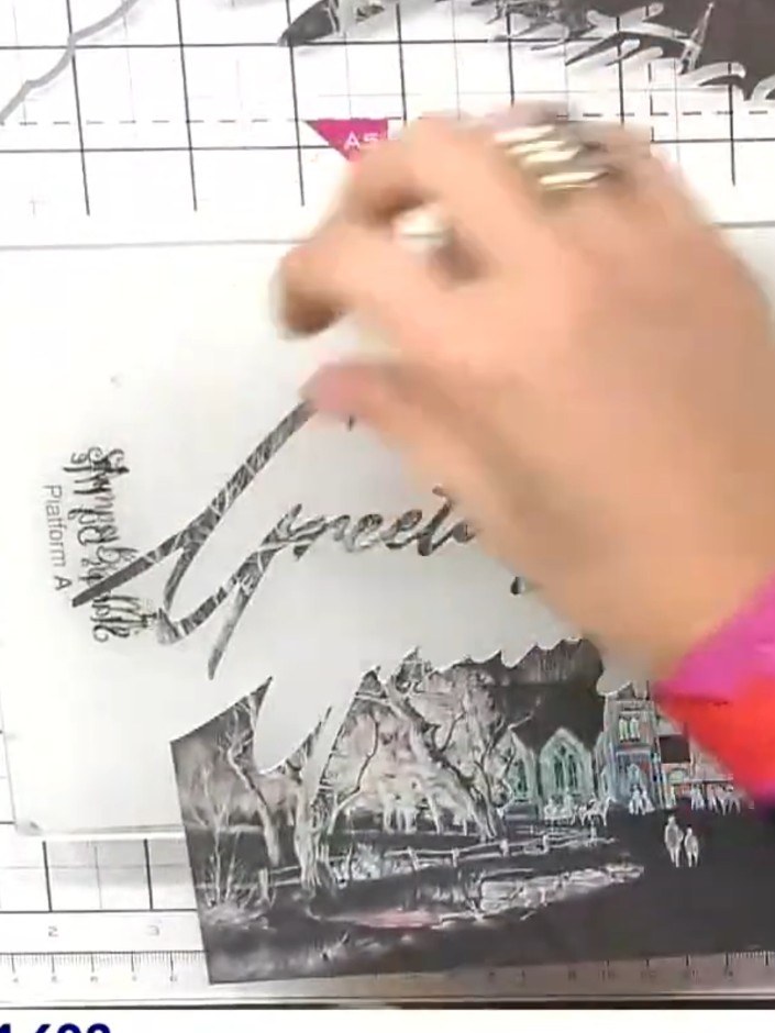 Step 2: Die-cut the word through the top portion of the patterned paper using the Christmas Snow Drift die. Position t