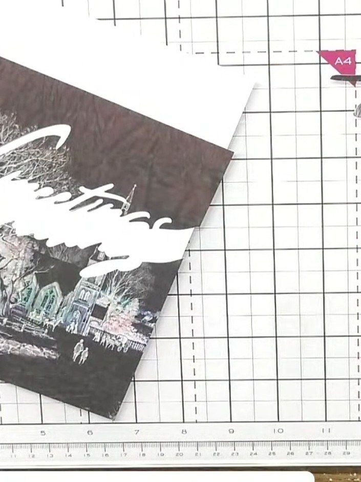 Step 4: Reposition the word die lower on the same patterned paper. Cut the bottom portion of the greetings word using 