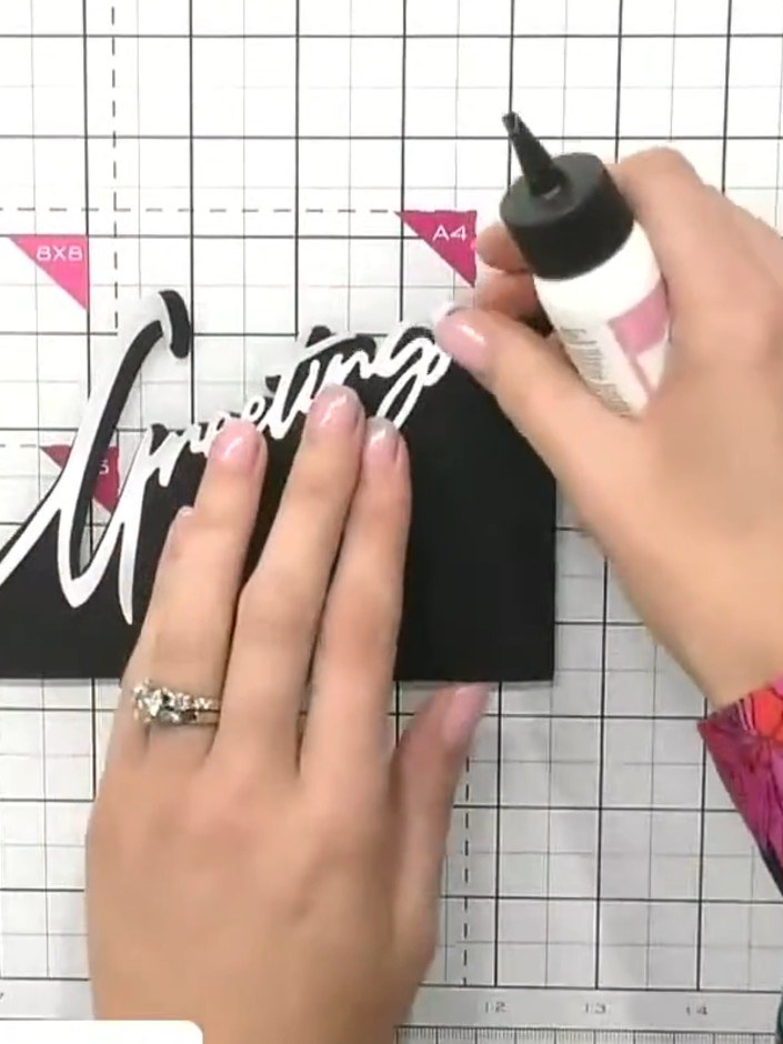 Step 4: Select one of the pre-printed mounted scenes from your chosen set. Apply glue to the back of the mounted scene