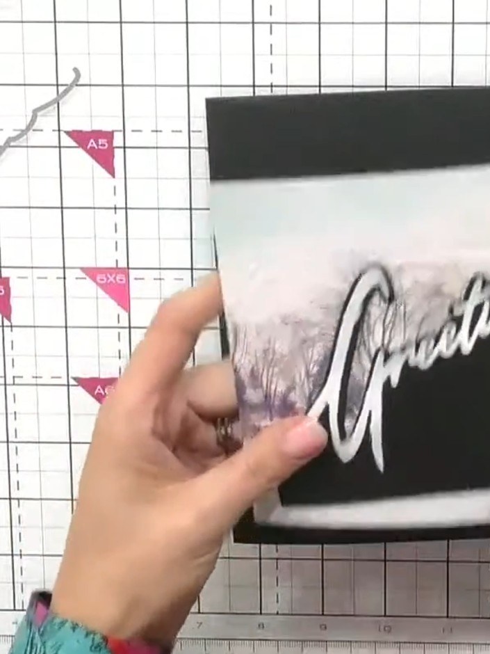 Step 5: Position the mounted scene piece on top of the snow drift card base, offsetting it slightly to one side rather