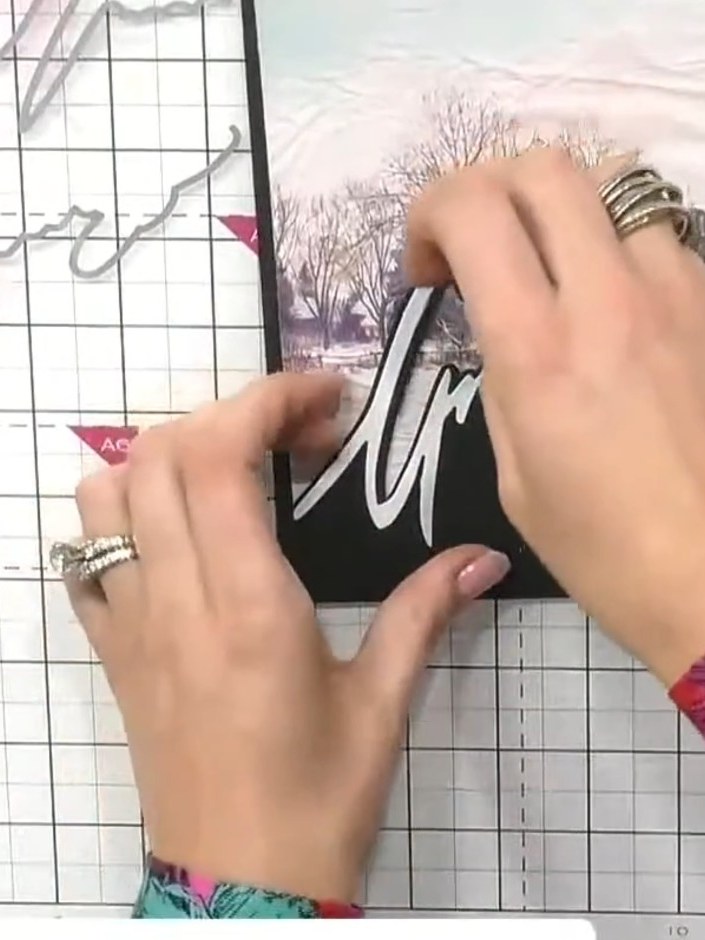 Step 7: Glue the shadow pieces back into the window frame on the black card mount to create depth and perspective. Pos