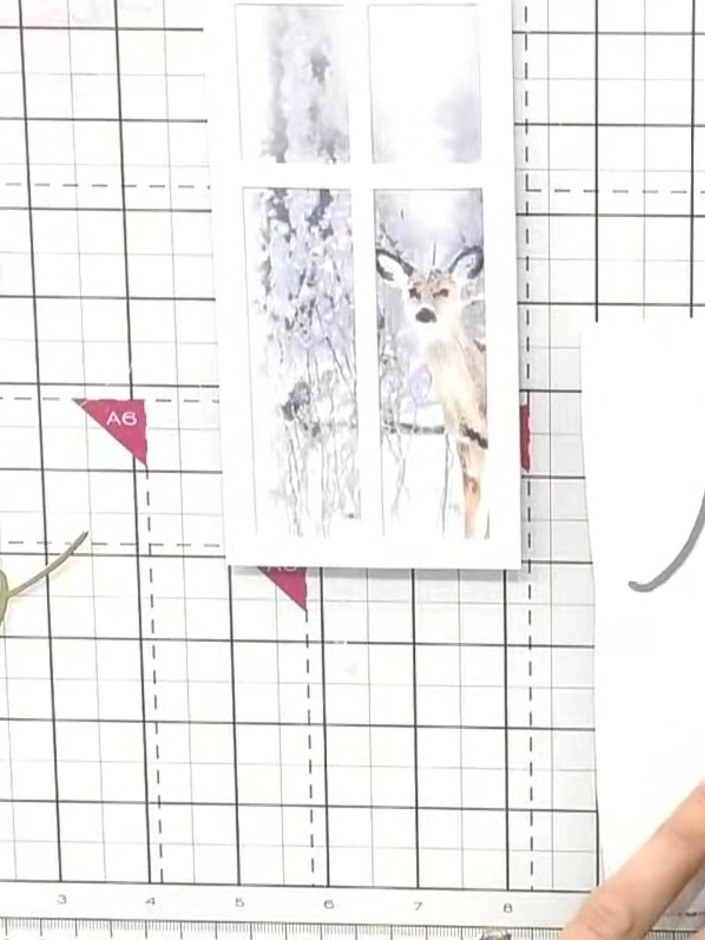 Step 3: Cut the slimline window die from white card. Use the 'Joy' die from the Christmas Snow Drift die set to create