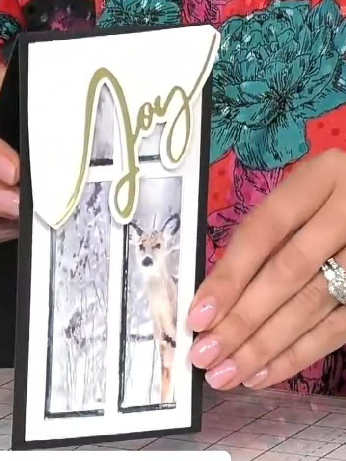 Step 9: Add sparkle or embellishments to the base of the card if desired to complete your Joy word card with lapel and
