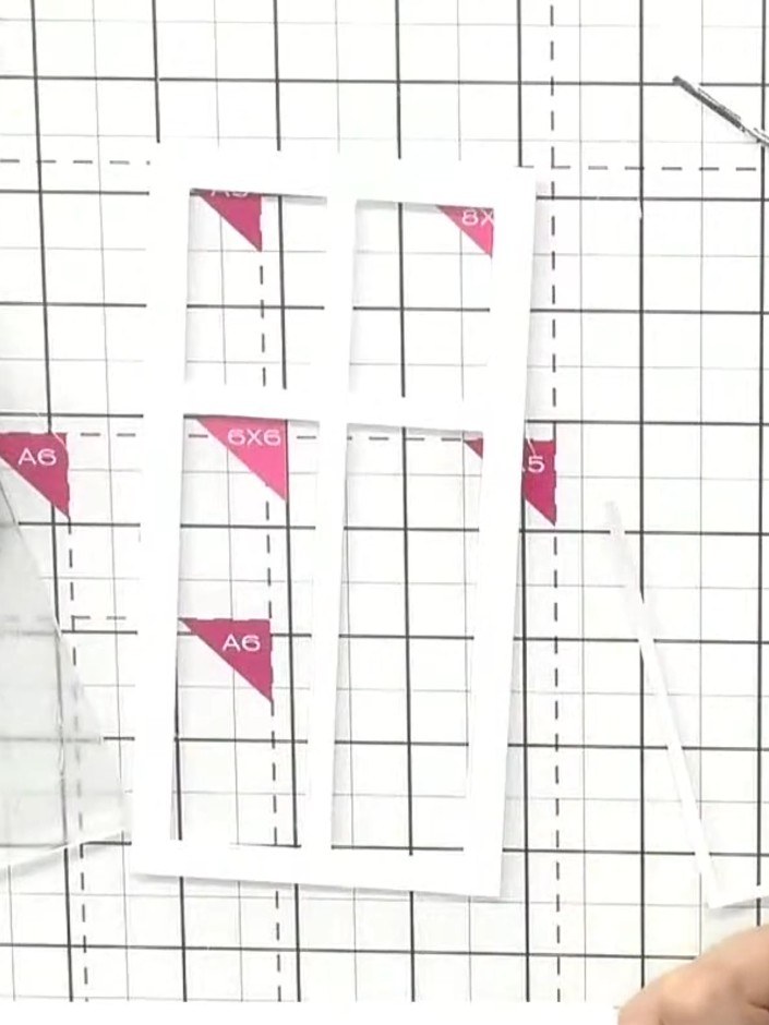 Step 6: Mount the completed window frame onto your card base, positioning it so the key elements of the scene (such as