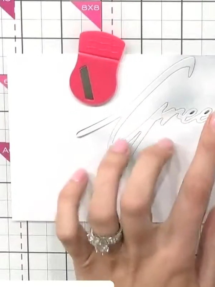 Step 4: Remove the 'Greetings' die from the white card and observe the subtle shading created by the ink blending arou