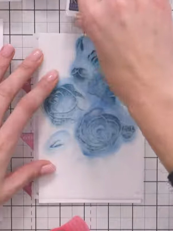 Step 7: Position the third stencil layer over your design and apply the teal shade with blue undertones using a blendi