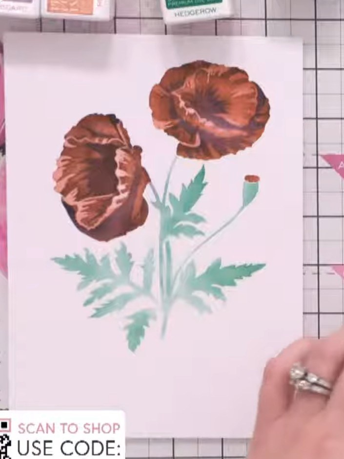Step 8: Using green ink, add the final details to complete the foliage on your design. Apply the ink to enhance the le