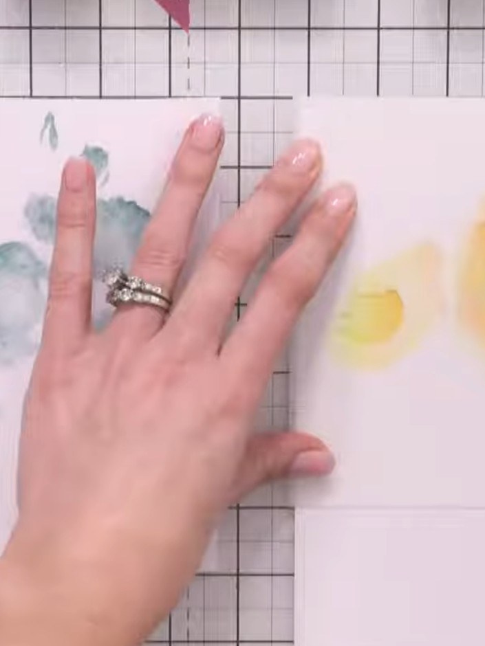 Step 2: Apply yellow ink through the first stencil using a blending brush. Build up the colour gradually with light da