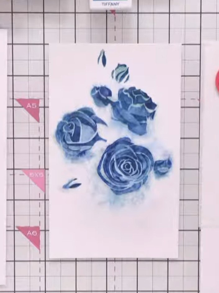 Step 5: Position the third layer of the Classic Rose stencil over your stamped image. Using a blending brush or sponge