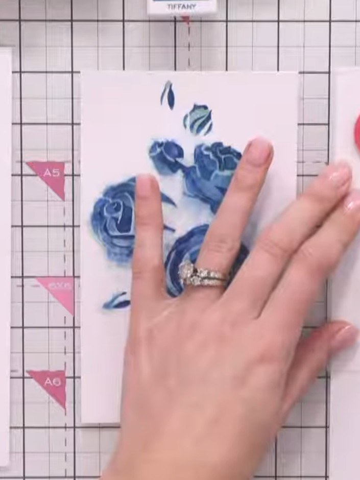 Step 6: Position the fourth stencil layer over your card and apply green ink using a blending tool to create the leave