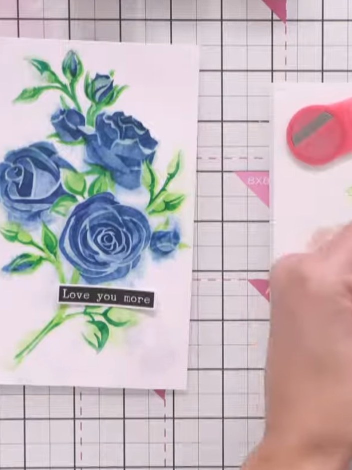 Step 8: Using a spatula, carefully apply blue glitter paste through the final stencil layer onto your card, working in