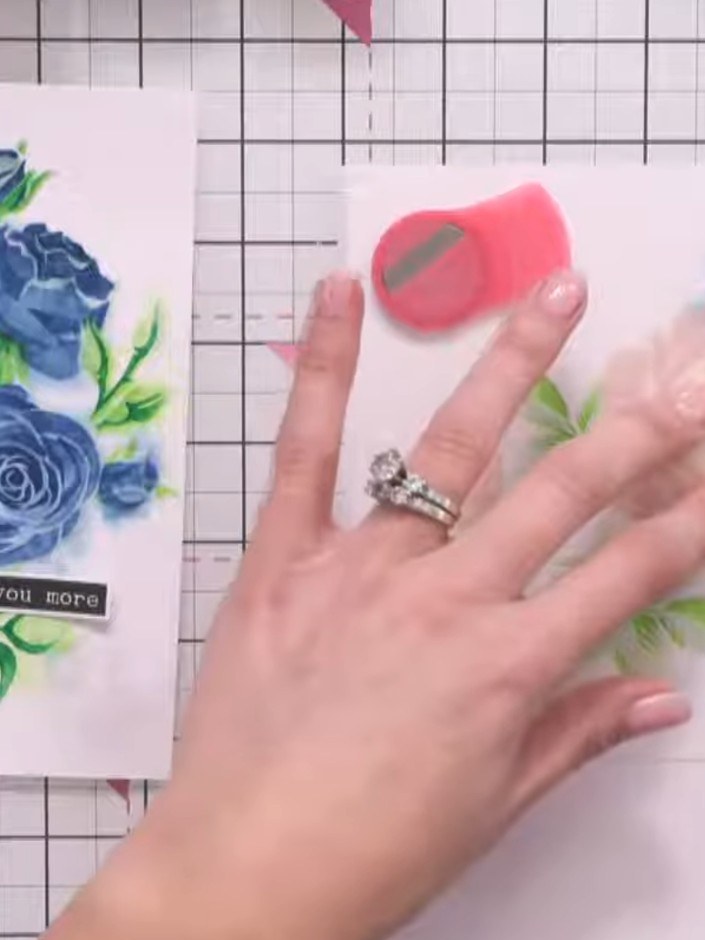 Step 9: Use the pink glitter paste applicator to carefully press the paste through the stencil onto your card. Take yo