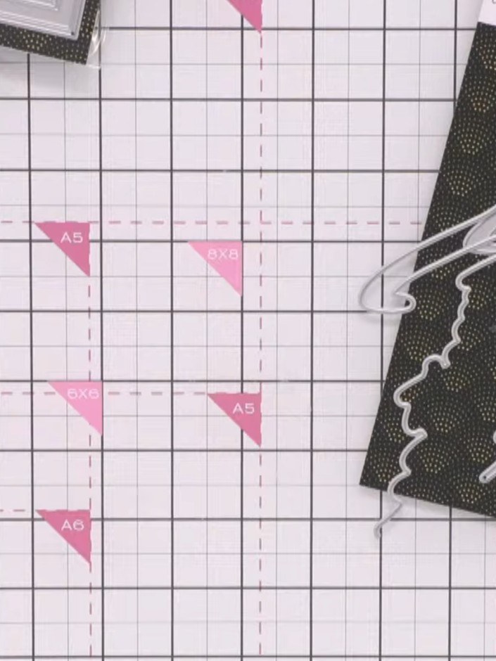 Step 1: Cut a piece of dark green patterned card and trim it to your desired card size using a trimmer or cutting mat 
