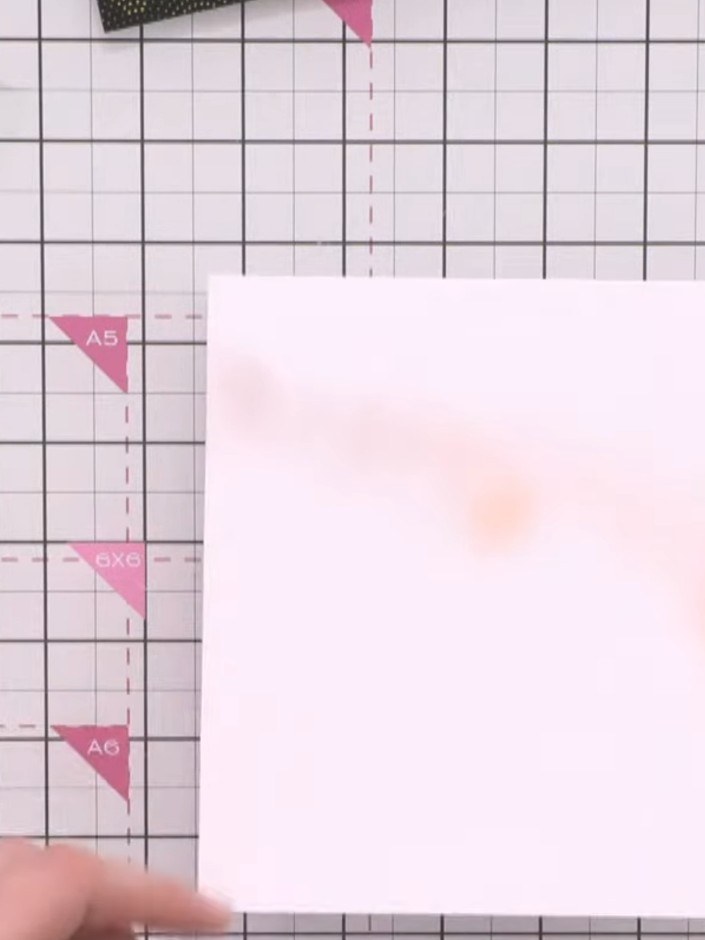 Step 5: Using a distress ink pad in a warm burnt orange or brown tone, apply a halo glow effect above where your Greet