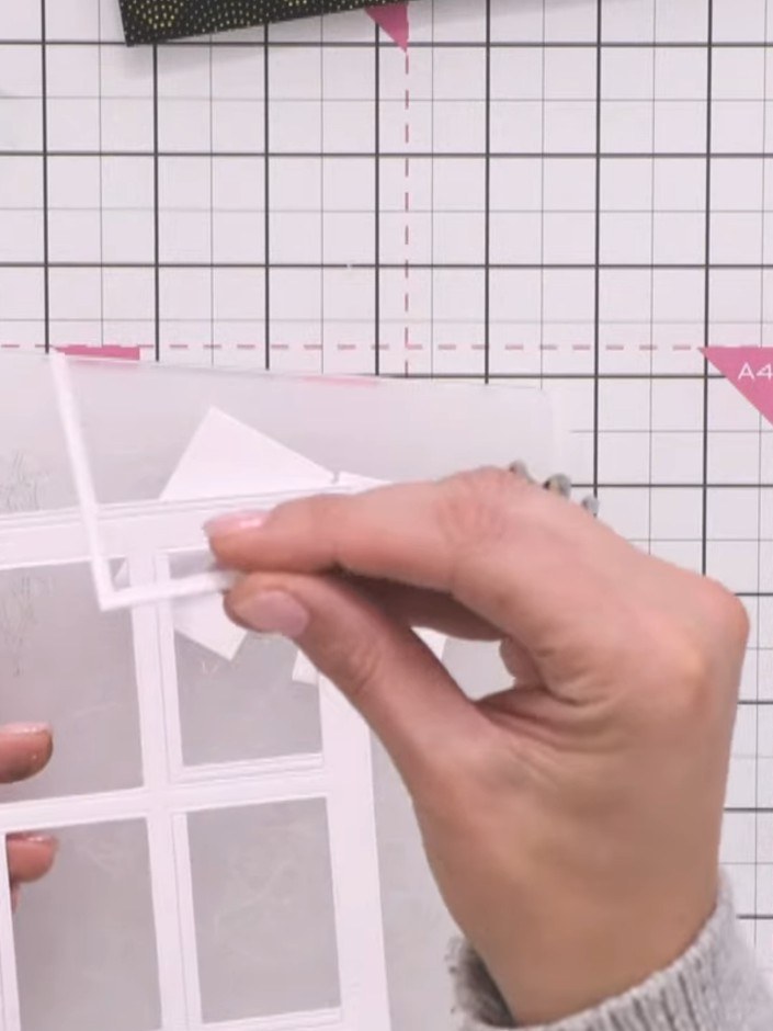 Step 3: Carefully remove the window frame from the card. Observe the L-shaped shadow pieces that have dropped out from