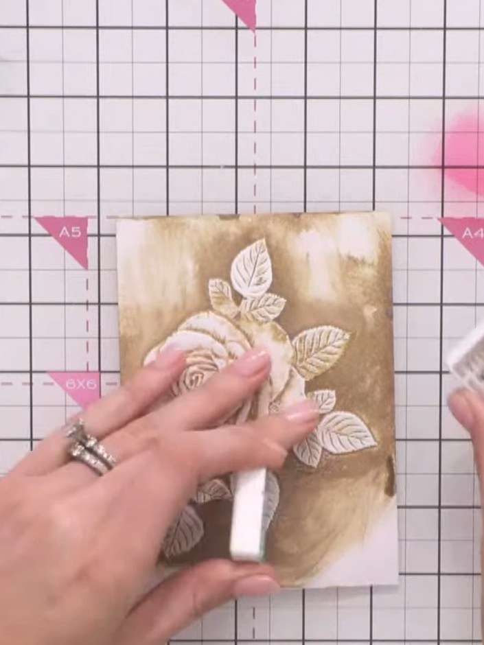 Step 10: Re-ink the embossing folder with the brown ink pad, applying it directly to the raised design. Do not spray wi