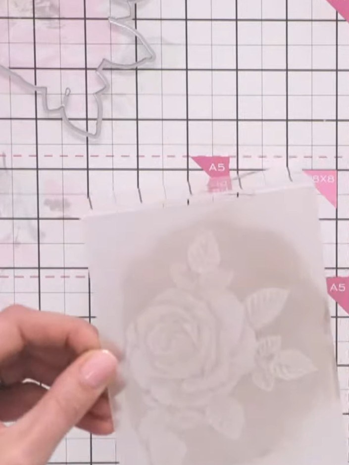 Step 11: Place your painted vellum card back into the embossing folder, ensuring it lines up with the original embossed