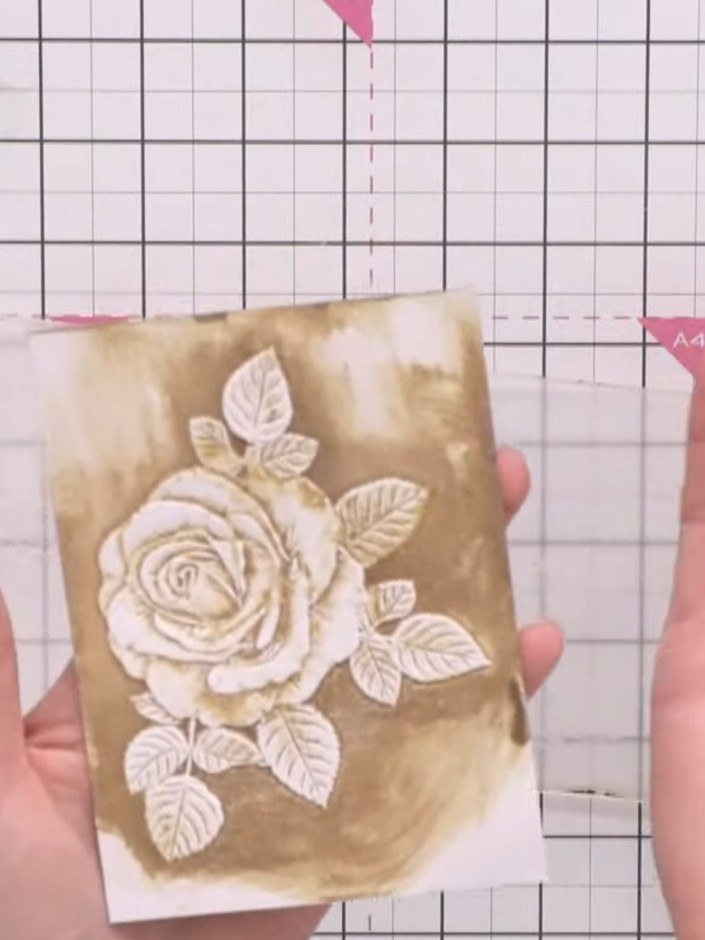 Step 8: Apply green ink to the leaves of the embossed rose design, varying the intensity. Leave some areas lighter to 