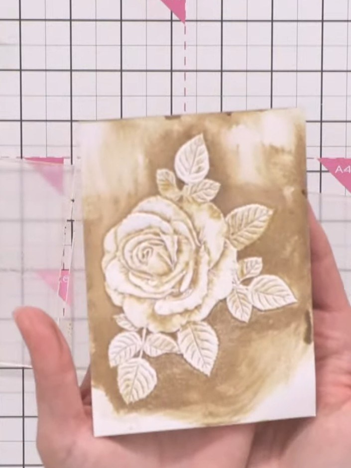 Step 9: Add teal ink to selected areas of the embossed rose image for additional depth and colour variation. Apply the