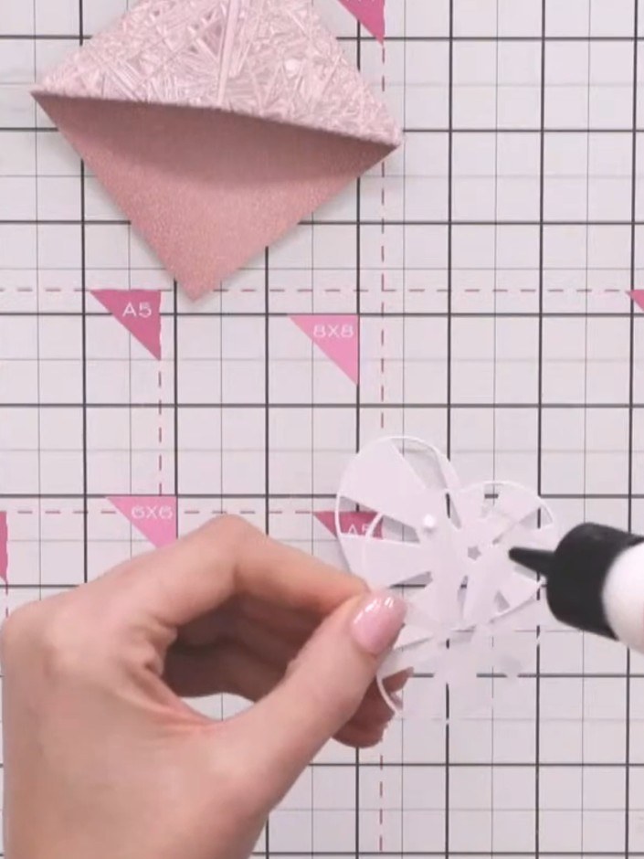 Step 10: Layer the heart die-cuts together using glue. Stack the largest piece first, then the medium piece, and finall