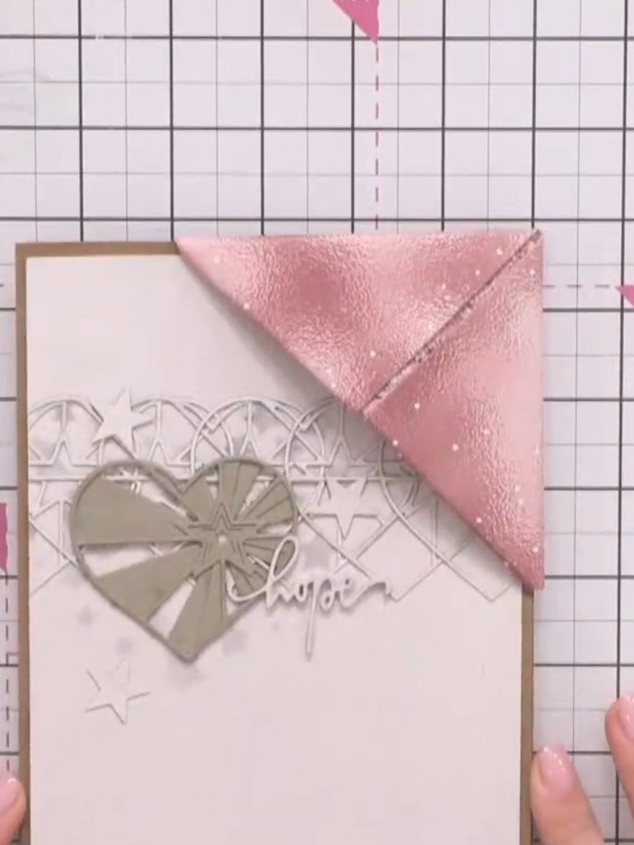 Step 8: Take a 6×6 inch piece of pink glitter paper and repeat the same folding process to create a smaller bookmark. 