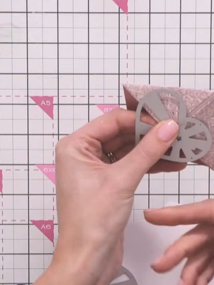 Step 9: Die-cut multiple heart shapes from white card. Cut each size three times for layering - you'll need three of e
