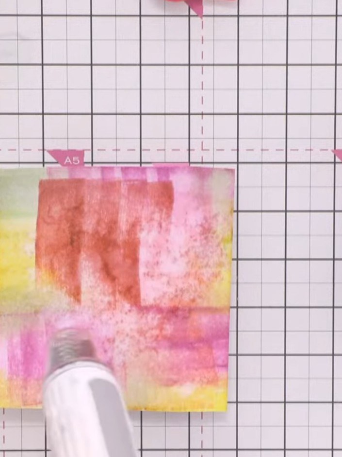 Step 7: Carefully remove the stencil from the watercolour background. Use a heat tool or allow the card to dry complet
